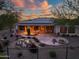 Landscaped backyard with large patio, stone water feature, desert landscaping, and covered patio at 40123 N Majesty Trl, Anthem, AZ 85086