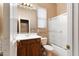 Bright bathroom featuring a single vanity, framed mirror, tile floor and enclosed shower at 40123 N Majesty Trl, Anthem, AZ 85086