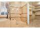 Luxurious bathroom with glass shower, soaking tub, and a well-organized walk-in closet at 40123 N Majesty Trl, Anthem, AZ 85086