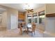Cozy breakfast nook with backyard views, built-in cabinets, and breakfast table at 40123 N Majesty Trl, Anthem, AZ 85086