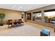 Open dining room with backyard views from two picture windows; includes table and server at 40123 N Majesty Trl, Anthem, AZ 85086