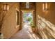 A decorative stone entryway with potted plants leading to the front of the home at 40123 N Majesty Trl, Anthem, AZ 85086