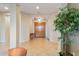 Light and bright foyer featuring tile flooring, neutral walls, and wooden double doors at 40123 N Majesty Trl, Anthem, AZ 85086