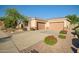 Single-story home features desert landscaping, a two-car garage, and a paved driveway in front yard at 40123 N Majesty Trl, Anthem, AZ 85086