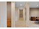 Hallway featuring neutral walls, tile flooring, and access to multiple rooms in the home at 40123 N Majesty Trl, Anthem, AZ 85086