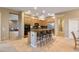 Open kitchen featuring island with bar seating, granite countertops, and stainless steel appliances at 40123 N Majesty Trl, Anthem, AZ 85086