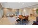 Open floor plan featuring neutral carpet, living area with fireplace, and dining area at 40123 N Majesty Trl, Anthem, AZ 85086