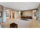 Open living and dining areas flow with natural light and fireplace detail at 40123 N Majesty Trl, Anthem, AZ 85086