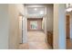 Open doorway looking into office space with neutral walls, carpet, and a window with shutters at 40123 N Majesty Trl, Anthem, AZ 85086