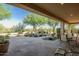 Comfortable outdoor patio area with beautiful views of the rock water feature and desert landscape at 40123 N Majesty Trl, Anthem, AZ 85086
