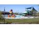 Community waterpark with splash pad, slides, seating and play area at 40123 N Majesty Trl, Anthem, AZ 85086