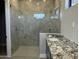 Luxurious bathroom showcasing a glass-enclosed shower and granite vanity at 4079 E Roosevelt St, Apache Junction, AZ 85119
