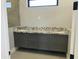 Bathroom vanity with granite countertops, gray cabinetry, and modern fixtures at 4079 E Roosevelt St, Apache Junction, AZ 85119