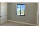 Bedroom with carpeted floor and white trim, featuring a window with a view at 4079 E Roosevelt St, Apache Junction, AZ 85119