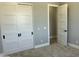 Bright bedroom featuring a closet with large sliding doors, plush carpet, and neutral paint at 4079 E Roosevelt St, Apache Junction, AZ 85119