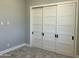 Bedroom with sliding closet doors and carpeted floor at 4079 E Roosevelt St, Apache Junction, AZ 85119