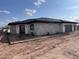 Well-appointed home with a stone facade, modern entry, two-car garage, and low maintenance landscaping at 4079 E Roosevelt St, Apache Junction, AZ 85119