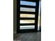 Modern front door with sidelights offering mountain views at 4079 E Roosevelt St, Apache Junction, AZ 85119
