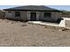 View of the home featuring stone accents, xeriscaping, and a modern front door at 4079 E Roosevelt St, Apache Junction, AZ 85119