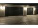 Two car garage with modern doors, modern lighting and concrete driveway at 4079 E Roosevelt St, Apache Junction, AZ 85119