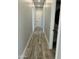 Hallway with wood-like flooring and doors leading to rooms at 4079 E Roosevelt St, Apache Junction, AZ 85119