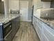 Kitchen detail including stainless appliances, granite countertops, and tile backsplash at 4079 E Roosevelt St, Apache Junction, AZ 85119
