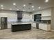 New open kitchen featuring granite countertops, a center island, stainless steel appliances, and designer lighting at 4079 E Roosevelt St, Apache Junction, AZ 85119