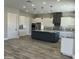 Eat-in kitchen featuring granite counters, a large island, and modern stainless steel appliances at 4079 E Roosevelt St, Apache Junction, AZ 85119