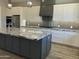 Granite counter tops accent the kitchen island which includes room for barstools at 4079 E Roosevelt St, Apache Junction, AZ 85119
