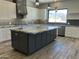 New open kitchen featuring granite countertops, a center island, stainless steel appliances, and mountain views at 4079 E Roosevelt St, Apache Junction, AZ 85119