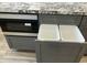 Kitchen island featuring microwave oven, and a pull-out trash can at 4079 E Roosevelt St, Apache Junction, AZ 85119