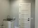 Laundry room with granite counters and white cabinets at 4079 E Roosevelt St, Apache Junction, AZ 85119