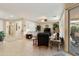 Spacious open-concept living room with neutral color palette, tile flooring, and large windows at 4245 E Ficus Way, Gilbert, AZ 85298
