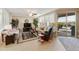 Bright living room featuring comfortable seating, tile floors, and sliding glass doors to the patio at 4245 E Ficus Way, Gilbert, AZ 85298