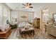 Relaxing main bedroom boasting natural light, complemented by wood floors and a cozy bench at 4245 E Ficus Way, Gilbert, AZ 85298