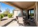 Inviting covered patio featuring a table and chairs, seamlessly blending indoor and outdoor living at 4245 E Ficus Way, Gilbert, AZ 85298