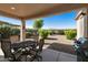 Enjoy the covered patio with an outdoor table and BBQ, perfect for relaxation or entertaining at 4245 E Ficus Way, Gilbert, AZ 85298