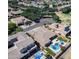 Expansive aerial view of a neighborhood with lush greenery and homes with backyard pools at 4266 E Blue Sage Ct, Gilbert, AZ 85297