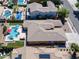 Aerial view of the property showcasing a sparkling pool, landscaped backyard, and well-maintained surroundings at 4266 E Blue Sage Ct, Gilbert, AZ 85297