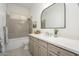 Stylish bathroom featuring a modern vanity, decorative tile accents, and ample natural light at 4266 E Blue Sage Ct, Gilbert, AZ 85297