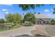 Exterior of a community clubhouse with walking path, pond view and well-maintained landscape at 4266 E Blue Sage Ct, Gilbert, AZ 85297