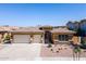 Charming single-story home with a spacious three-car garage and well-manicured front yard at 4266 E Blue Sage Ct, Gilbert, AZ 85297