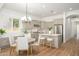Bright kitchen features stainless steel appliances, white subway tile backsplash, and an island with bar seating at 4266 E Blue Sage Ct, Gilbert, AZ 85297