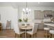 Bright kitchen boasts dining area, white countertops, stainless steel appliances, and neutral-colored cabinets at 4266 E Blue Sage Ct, Gilbert, AZ 85297