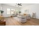 Light filled living room with stylish furnishings and multiple windows providing lots of natural light at 4266 E Blue Sage Ct, Gilbert, AZ 85297