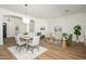 Open living space with hardwood flooring, neutral paint, and modern furnishings for a bright and airy feel at 4266 E Blue Sage Ct, Gilbert, AZ 85297
