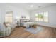 Serene main bedroom with neutral tones, wood flooring, comfortable furnishings, and lots of natural light at 4266 E Blue Sage Ct, Gilbert, AZ 85297