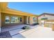 Covered patio area leading to a beautifully landscaped backyard with a built-in BBQ, perfect for entertaining outdoors at 4266 E Blue Sage Ct, Gilbert, AZ 85297