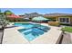 Stunning backyard pool with clear blue water, a spa, and ample lounging space, offering a perfect retreat at 4266 E Blue Sage Ct, Gilbert, AZ 85297
