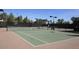 Well-maintained tennis courts with new nets and fencing with shaded picnic area at 4266 E Blue Sage Ct, Gilbert, AZ 85297